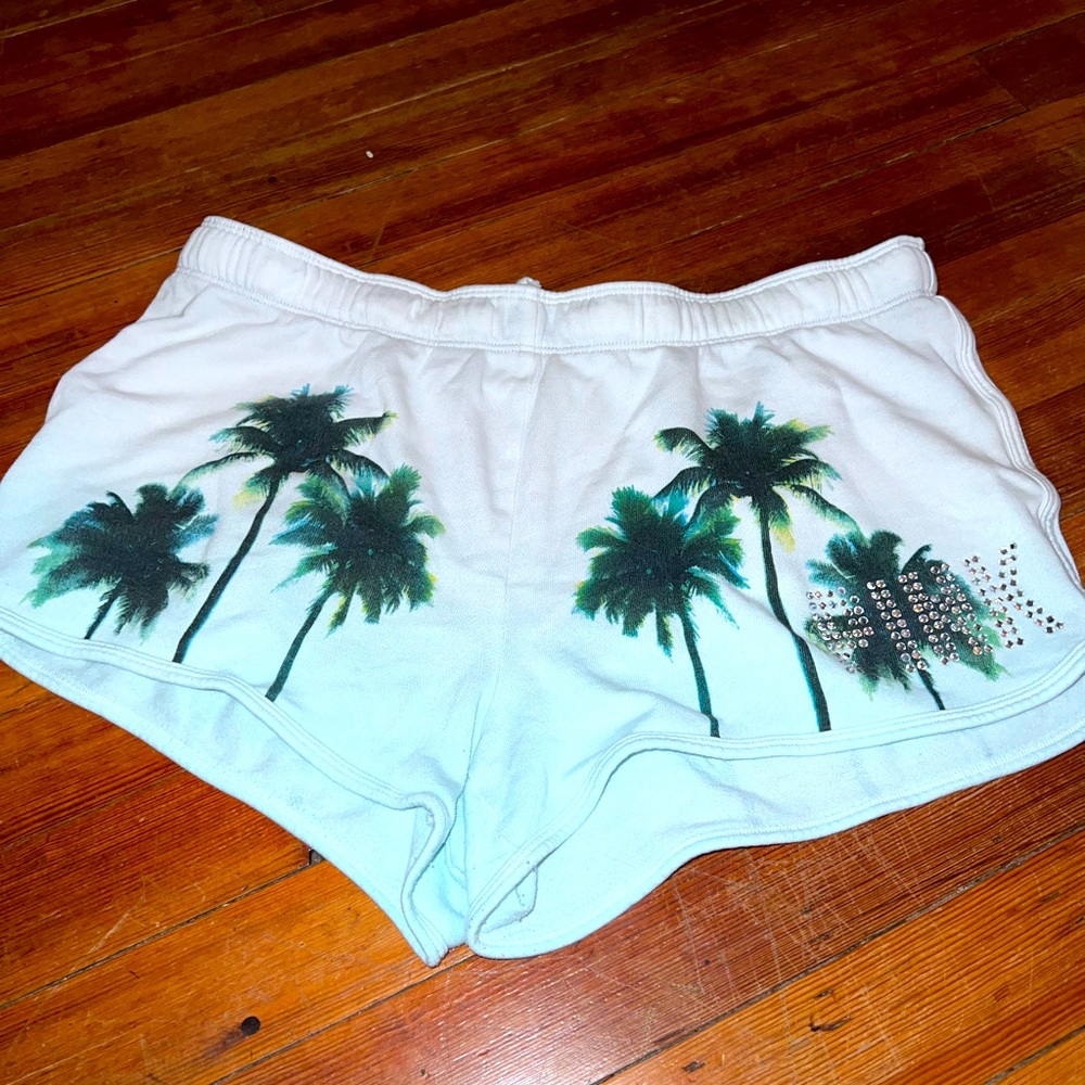 Pink brand shorts, palm trees and diamond accents